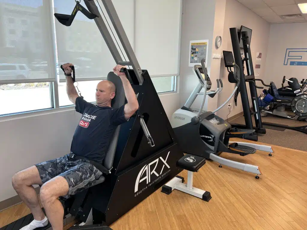 Avignon Windhaven, TX personal trainer using time-saving fitness technology during workout