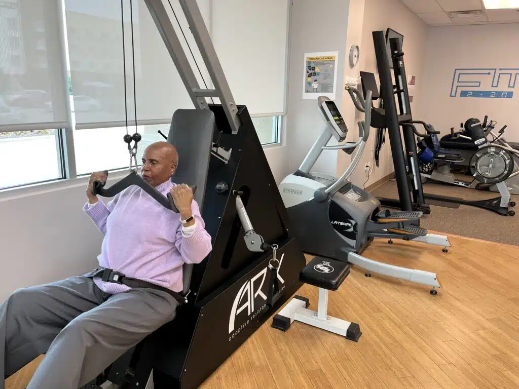 Whiffletree, TX personal trainer showing client how short technology-enhanced workouts deliver results