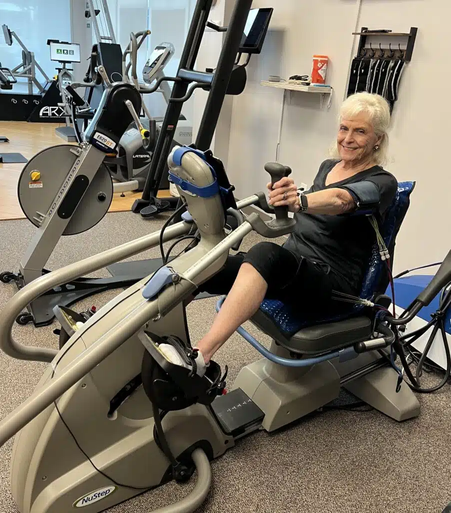 Plano, TX personal trainer guiding client through short isokinetic training workout